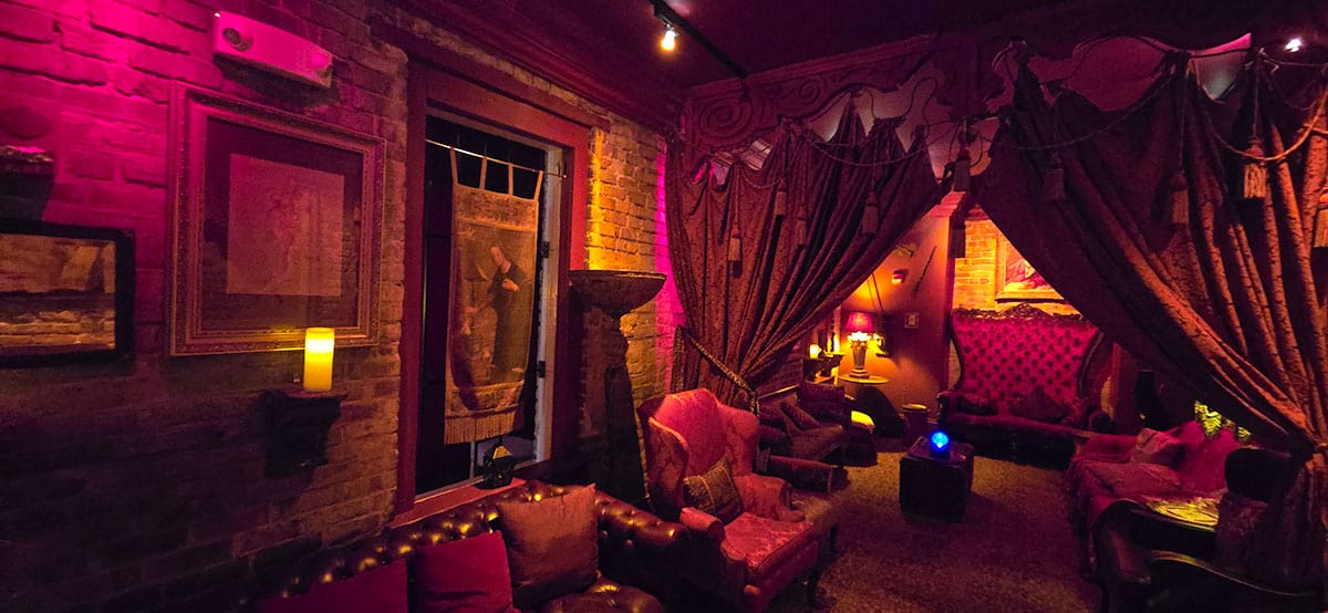 The haunted seance lounge at Muriels. A small room decorated with victorian style furniture.